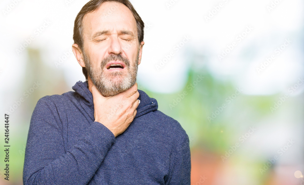 Middle age handsome man wearing a sweater Touching painful neck, sore throat for flu, clod and infection Middle age handsome man wearing a sweater Touching painful neck, sore throat for flu, clod and infection