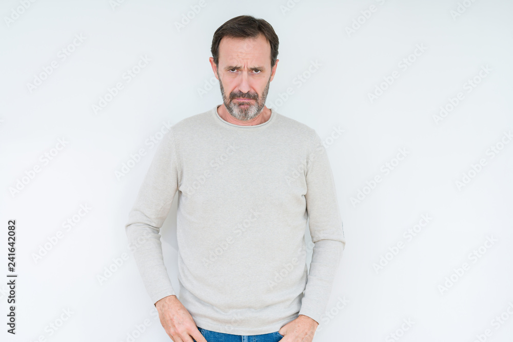Fototapeta premium Elegant senior man over isolated background depressed and worry for distress, crying angry and afraid. Sad expression.