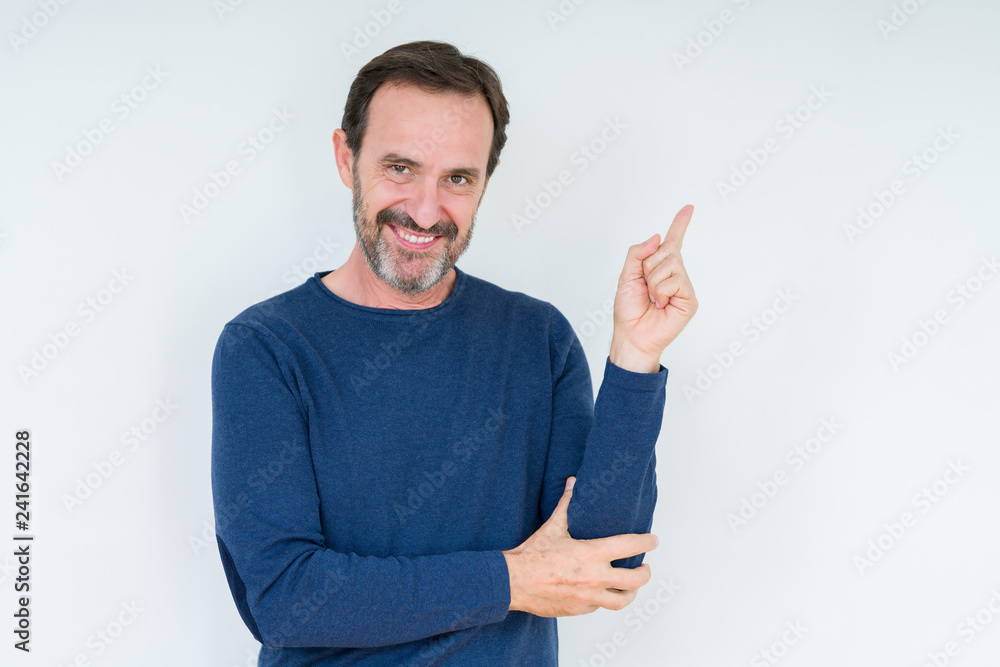 Elegant senior man over isolated background with a big smile on face, pointing with hand and finger to the side looking at the camera. Elegant senior man over isolated background with a big smile on face, pointing with hand and finger to the side looking at the camera.