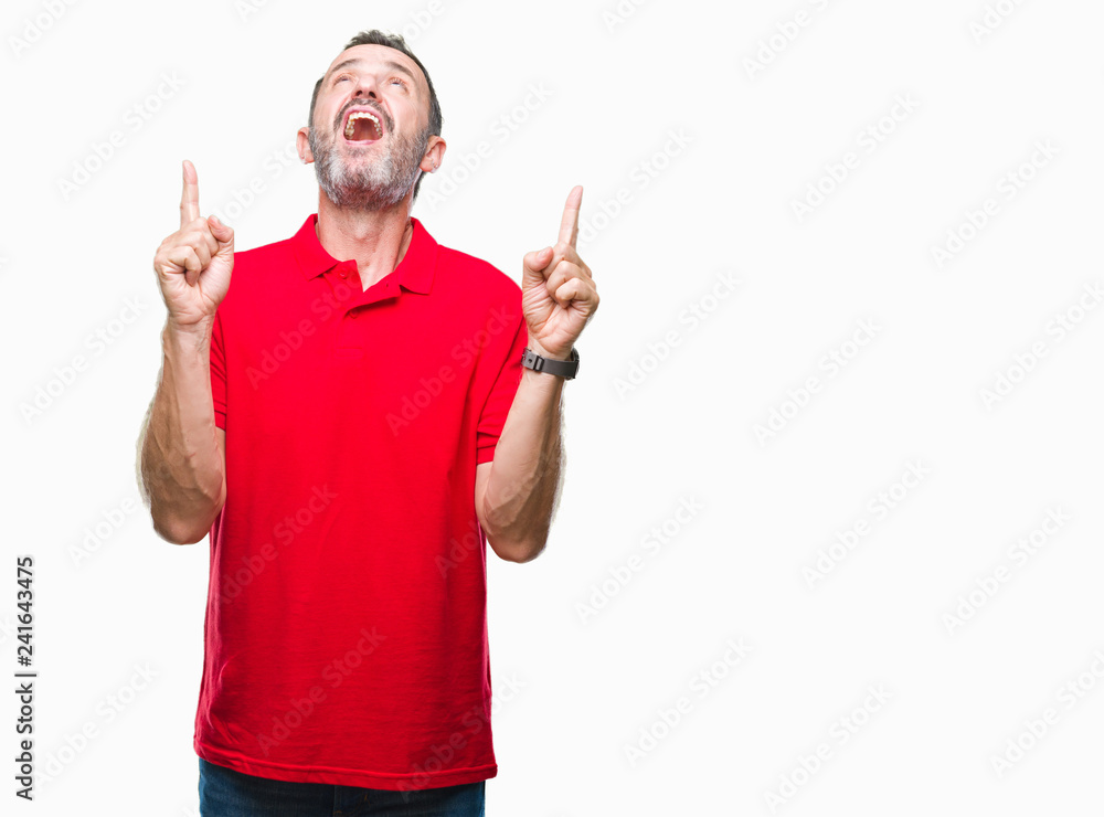 Middle age hoary senior man over isolated background amazed and surprised looking up and pointing with fingers and raised arms. Middle age hoary senior man over isolated background amazed and surprised looking up and pointing with fingers and raised arms.