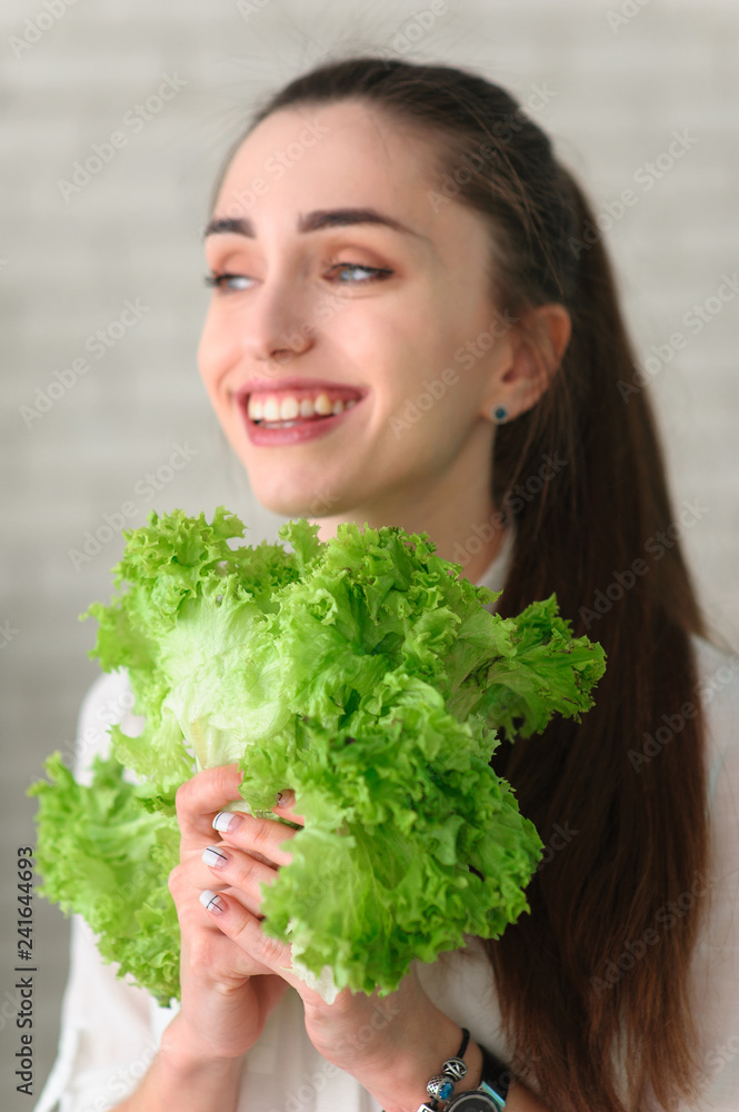 Young Woman Cooking. Healthy Food - Vegetable Salad. Diet. Healthy Lifestyle. Cooking At Home. Prepare Food Young Woman Cooking. Healthy Food - Vegetable Salad. Diet. Healthy Lifestyle. Cooking At Home. Prepare Food