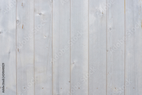 Texture of vertical pale white wooden floor or wall surface.