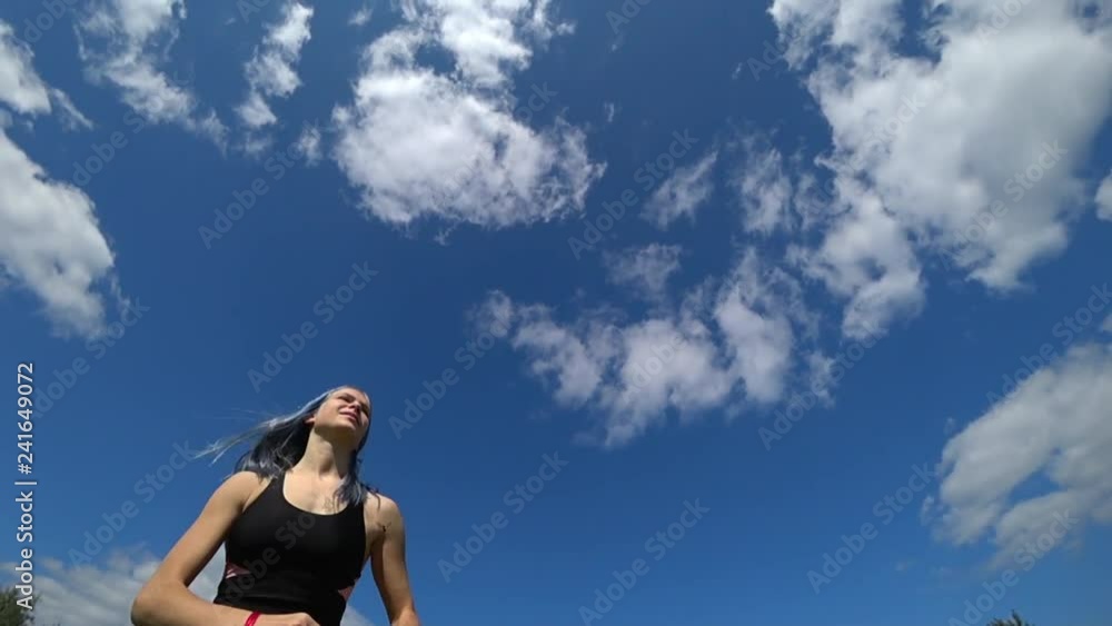 Cute girl playing frisbee ouside in the park in summer in slow motion Cute girl playing frisbee ouside in the park in summer in slow motion