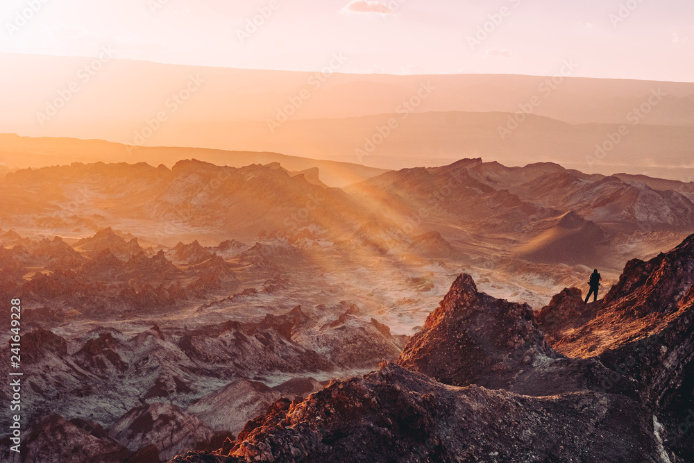 atacama desert hike peak sunset rays Chile