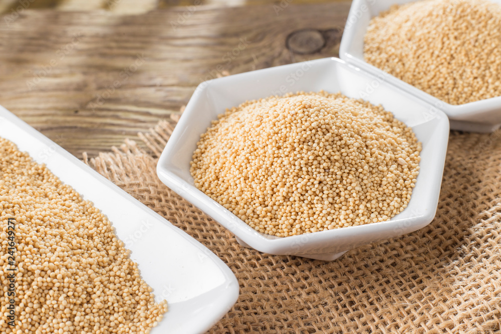 amaranth beans in bowl, on rustic wooden background amaranth beans in bowl, on rustic wooden background