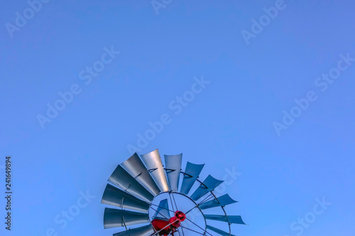 Windmill in sky with lots of copy space above