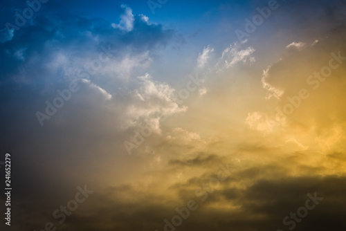 dramatic sky clouds / Sky sunset over with clouds the storm beautiful blue yellow and orange background