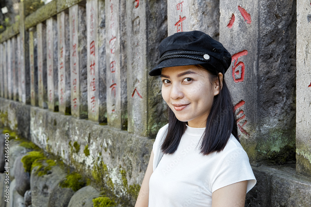 Front view portrait of a happy woman tourist Front view portrait of a happy woman tourist