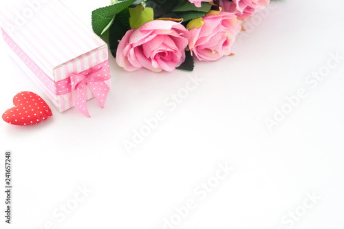 Pink roses  Gift box and heart on white background