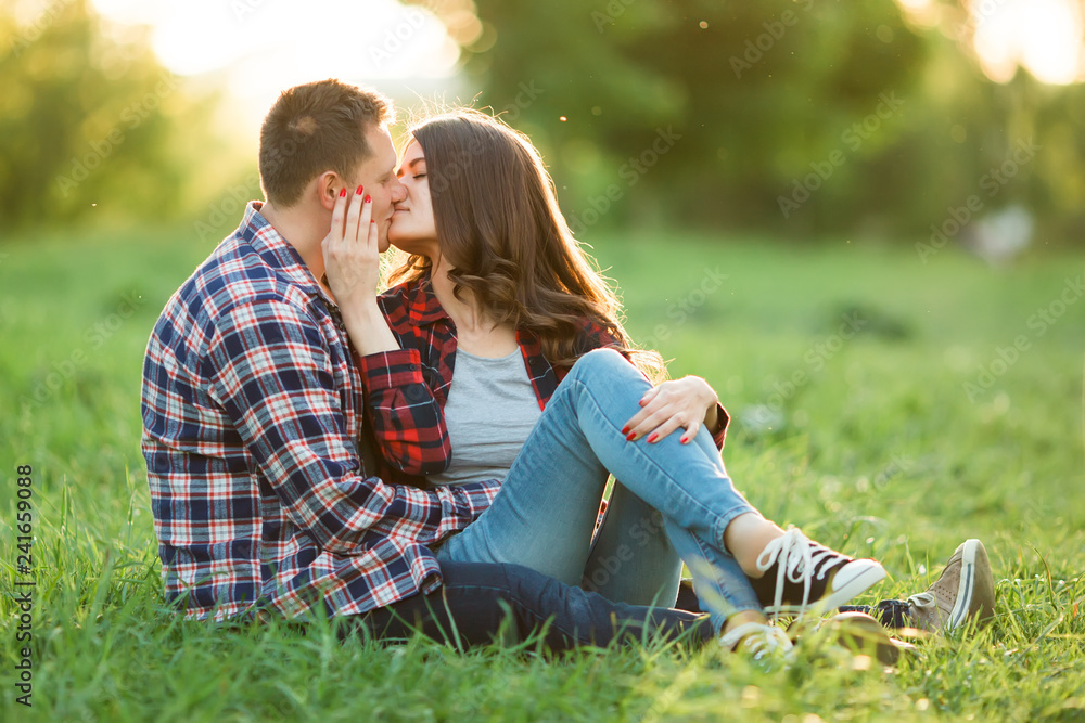 Happy couple relaxing in the park