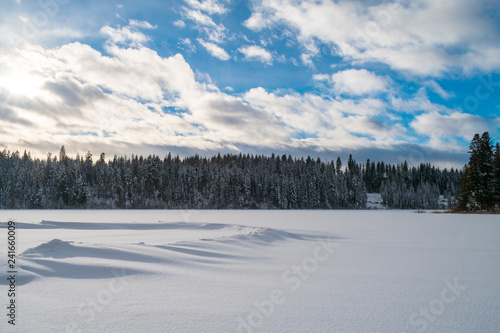 Fresh Snow Drifts On Frozen Lake