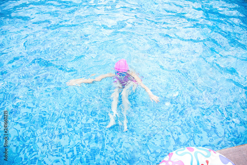 Asian little girl swimming