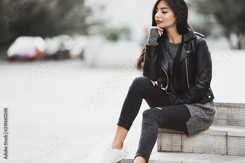 Beautiful model poses for the camera on the streets.