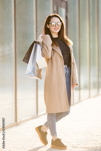 Wallpaper Mural Happy young woman with shopping bags Torontodigital.ca