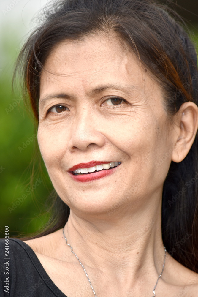 Older Asian Female Senior Smiling