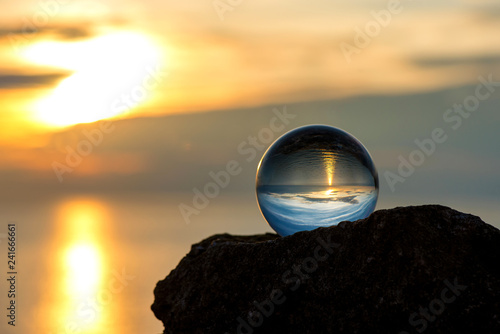  Upside down sunset landscape at Cape Kaliakra  Bulgaria  Eastern Europe - reflection in a lensball - selective focus  space for text
