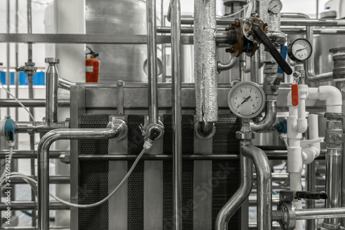 measurement sensors and pipes in the factory. equipment at the dairy plant