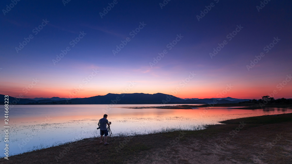 Landscape of sunset and photographer