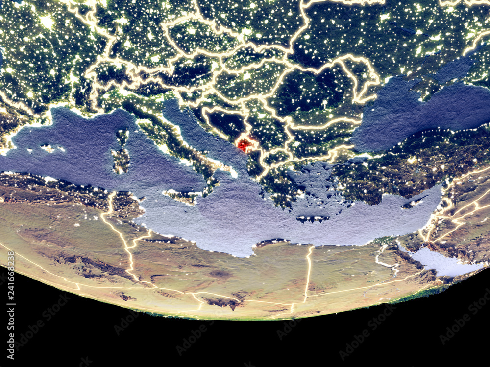 Satellite view of Montenegro from space at night. Beautifully detailed plastic planet surface with visible city lights.
