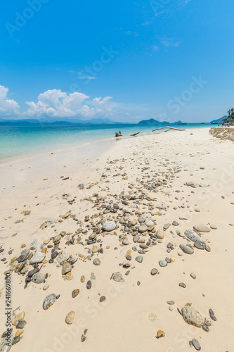 White sand beach and Long-tail boat at Khang Khao Island (Bat island), The beautiful sea Ranong Province, Thailand. © PRASERT