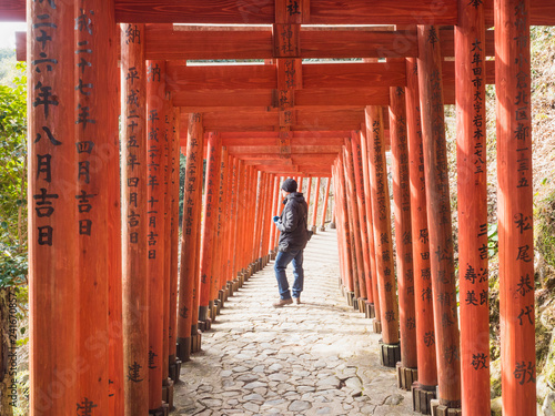 January 31, 2018. Red torii in Yūtoku Inari Shrine. Photographers are considering the composition to elaborate the image that will inspire. photo