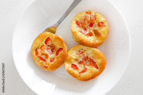 Healthy breakfast egg muffins with cheese and tomato, easy and healthy food concept