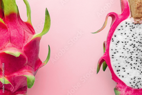 Fresh organic dragon fruit on a pink background, creative summer food concept