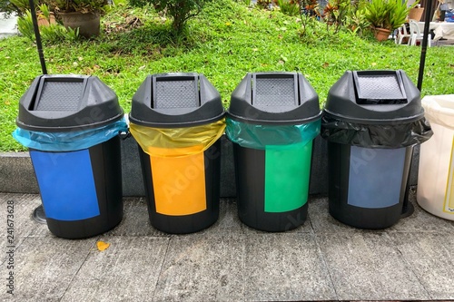 Difference Colored Bins For Collection Of Recycle Materials photo