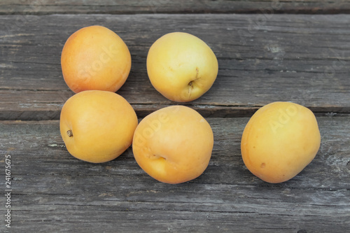 natural, organic apricot on a wooden background
