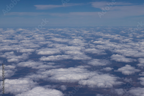 Flying above the clouds. View from the airplane, soft focus. 