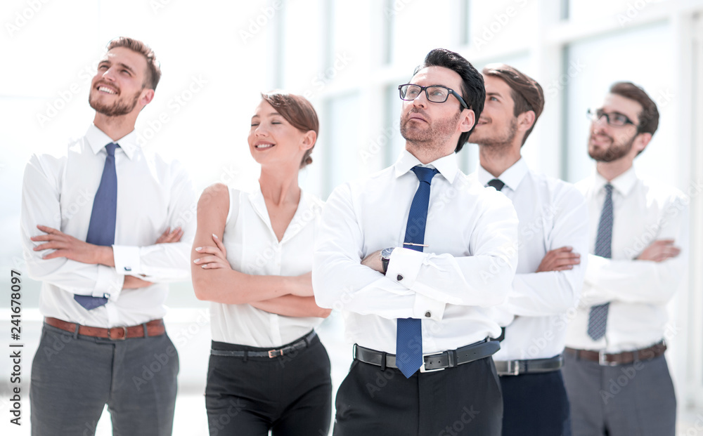 business team standing together and looking at copy space. business team standing together and looking at copy space.
