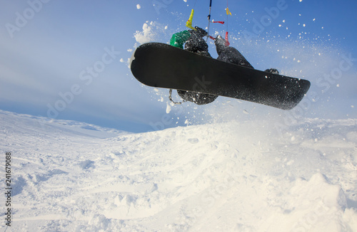 Weekend activities - snowkiting! Extreme and fun! A trip to the Russian North to kite in show white tundra is a great trip adventure! Freestyle rotation high move trick with board snow powder action