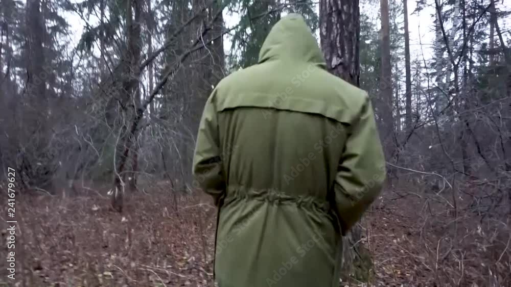 A man walks through the autumn forest A man walks through the autumn forest
