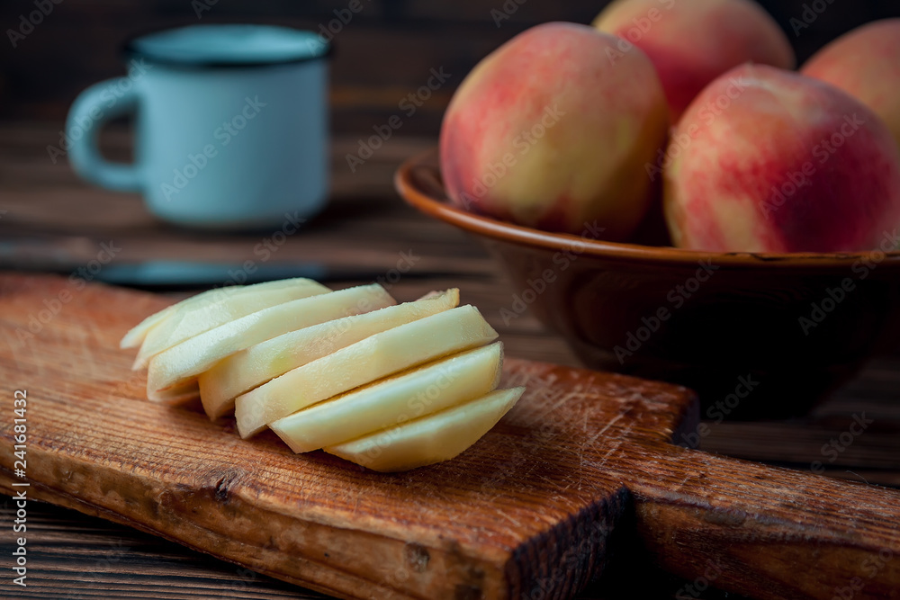 peaches on rustic wooden table background