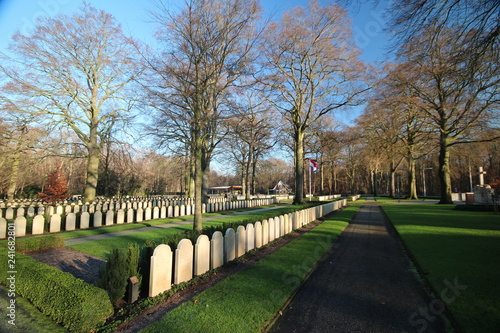 Gravestones and statues on the military field of honour at the Grebberberg in the Netherlands, where lof of solders felt in 5 days at start of world war II