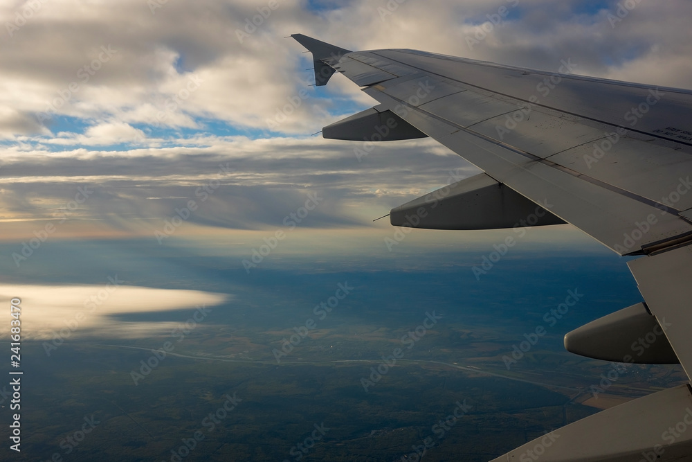 Fototapeta premium Airplane Wing in Flight, looking through window