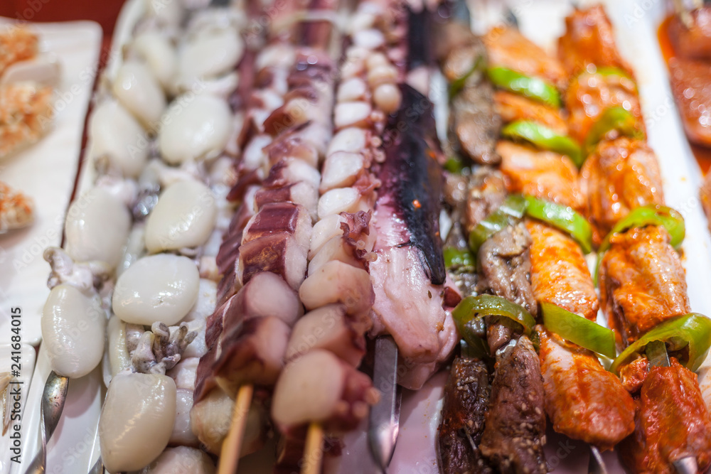 seafood octopus tentacles on sticks, fresh octopus on a stick seafood octopus tentacles on sticks, fresh octopus on a stick