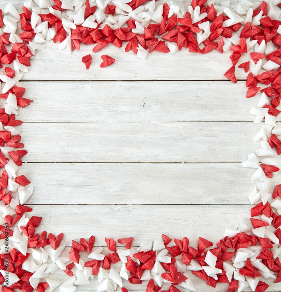 White and red  paper heart on wooden