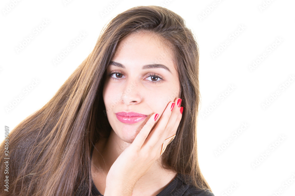 brunette young beautiful woman smiling and touching her face isolated over white background in natural makeup brunette young beautiful woman smiling and touching her face isolated over white background in natural makeup