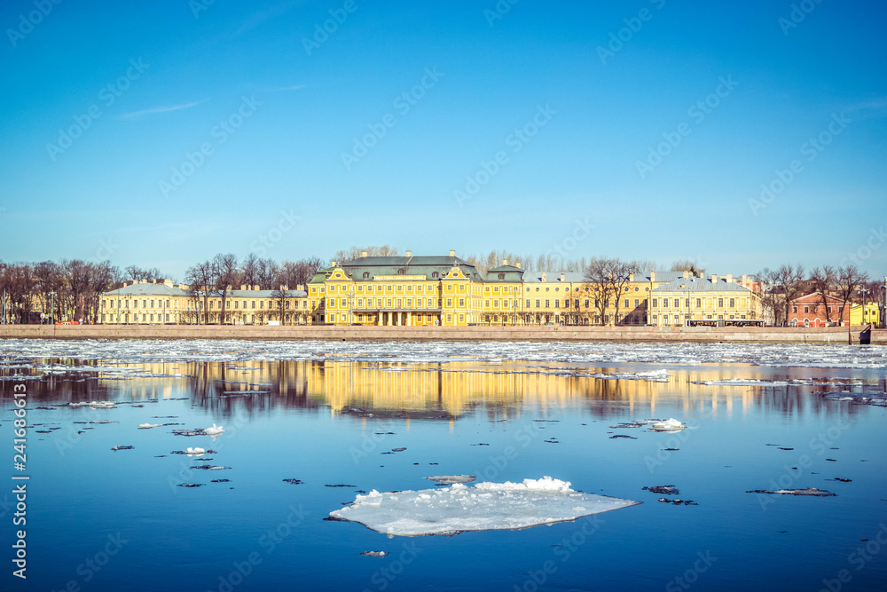 St. Petersburg granite embankment, panoramic view from Neva River on cityscape and architecture of city,  spring ice drift, Saint Petersburg, Russia.