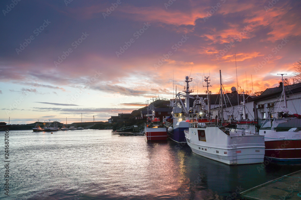 selective focus fisherman boat dock at pier after sunset sky in Lofoten Islands, Norway