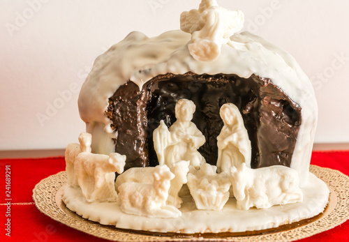 chocolate nativity scene. Traditional panettone with the white chocolate nativity scene
