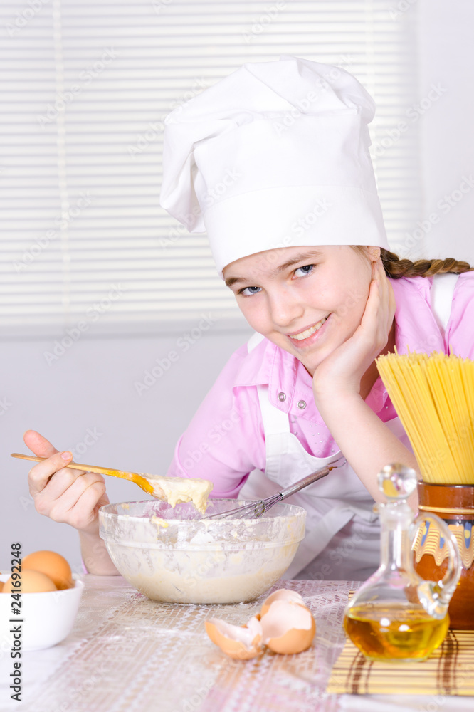 Close-up portrait of cute girl cooking in the kitchen Close-up portrait of cute girl cooking in the kitchen