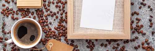 Coffee cup and beans on old stone kitchen table. Panoramic top view with copyspace for your text. Mockup wooden frame. Vintage style © Ester_K