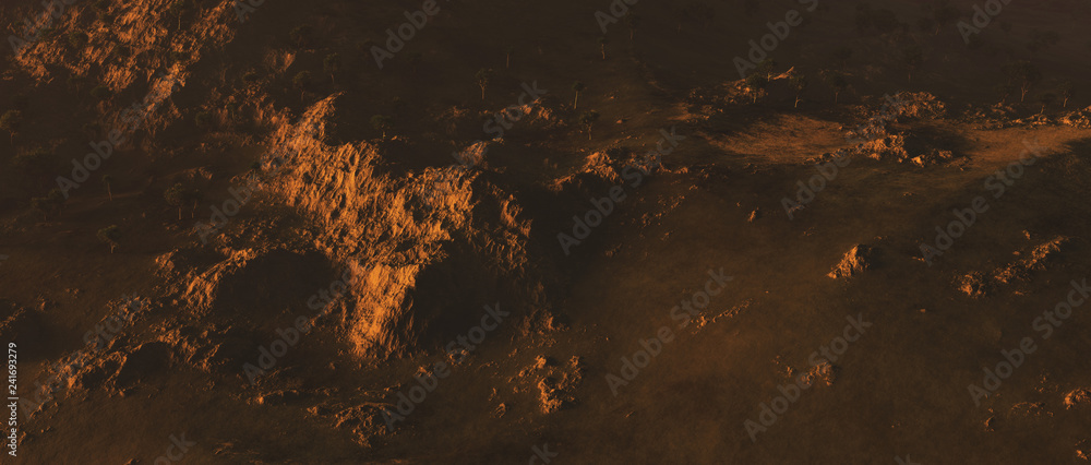 Bare mountains with trees in evening sunlight. Aerial view. - obrazy, fototapety, plakaty 