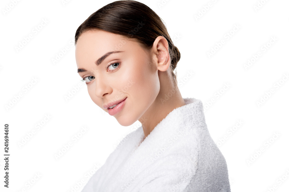 attractive woman in bathrobe looking at camera isolated on white