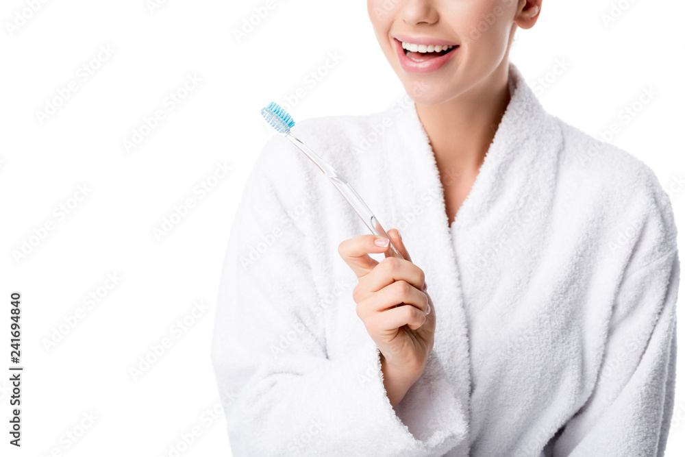 partial view of woman in white bathrobe holding toothbrush isolated on white partial view of woman in white bathrobe holding toothbrush isolated on white