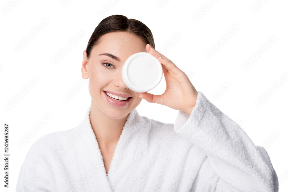beautiful woman in bathrobe holding moisturizing cream in front of face isolated on white beautiful woman in bathrobe holding moisturizing cream in front of face isolated on white