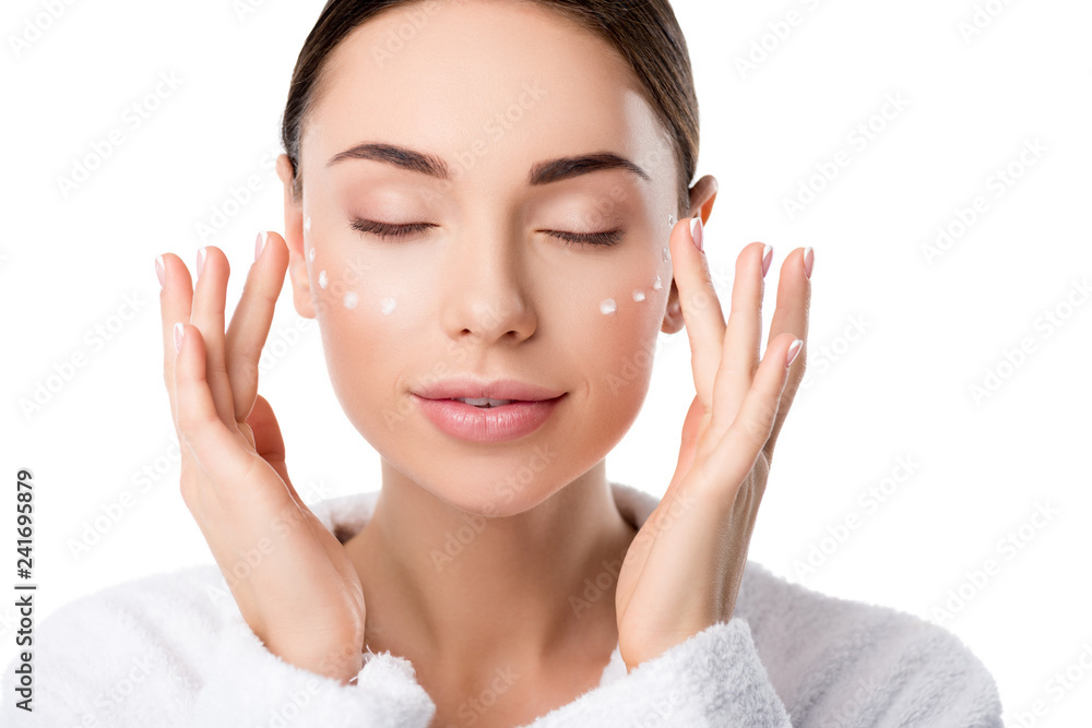 beautiful woman with eyes closed applying moisturizing face cream isolated on white beautiful woman with eyes closed applying moisturizing face cream isolated on white