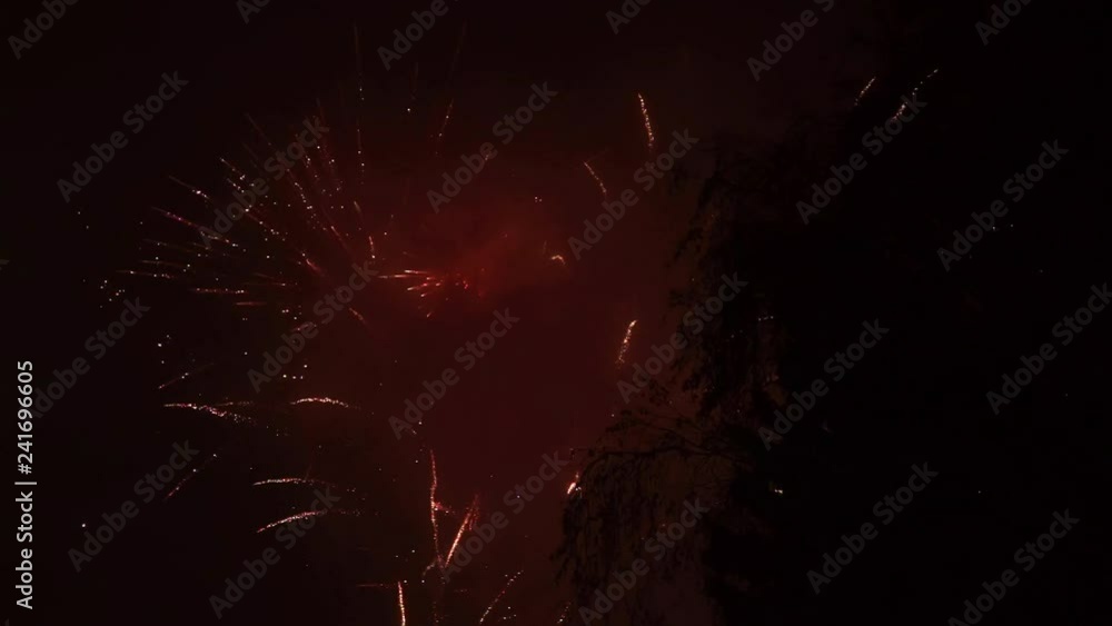 Fireworks over the city on the New Year's Eve, in the foggy weather and with smoke. Slow motion 250 fps Fireworks over the city on the New Year's Eve, in the foggy weather and with smoke. Slow motion 250 fps